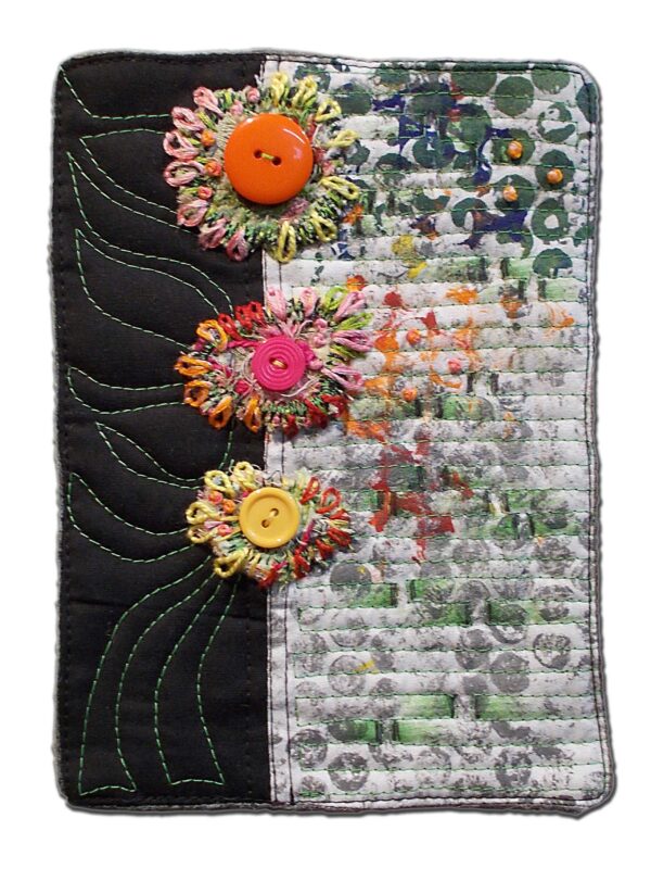 Hand painted and dyed fabric. Machine quilted, embellished with embroidery stitches, glass beads, and buttons. Attached to a canvas art board.