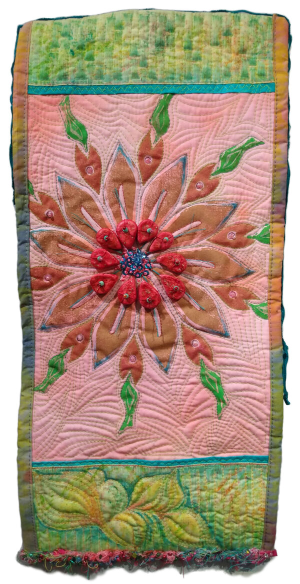 Machine pieced and quilted wall hanging in spring colors.